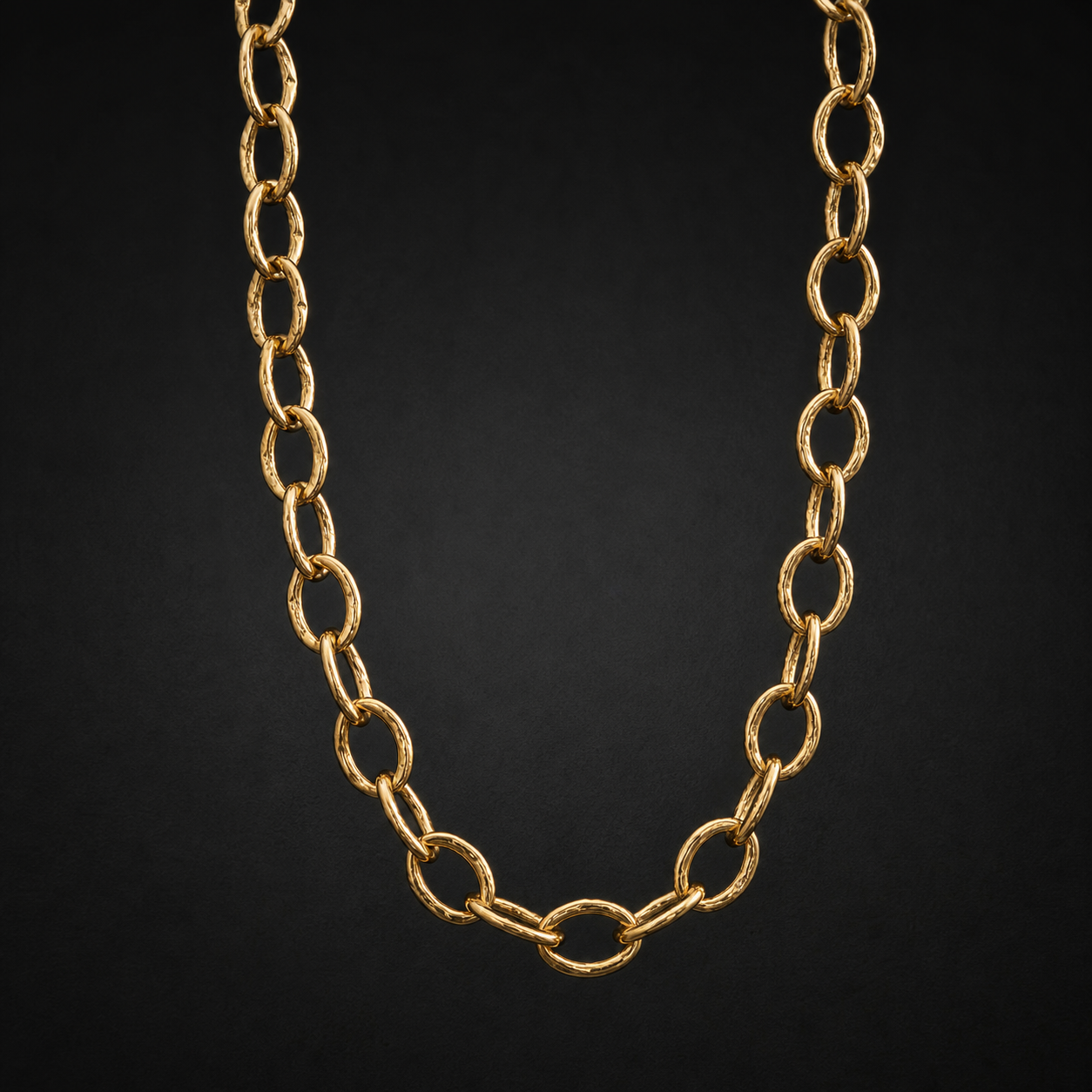 Photograph of a hand-forged gold chain necklace